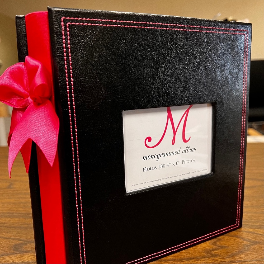 Photo Album black with pink stitching and bow on binding